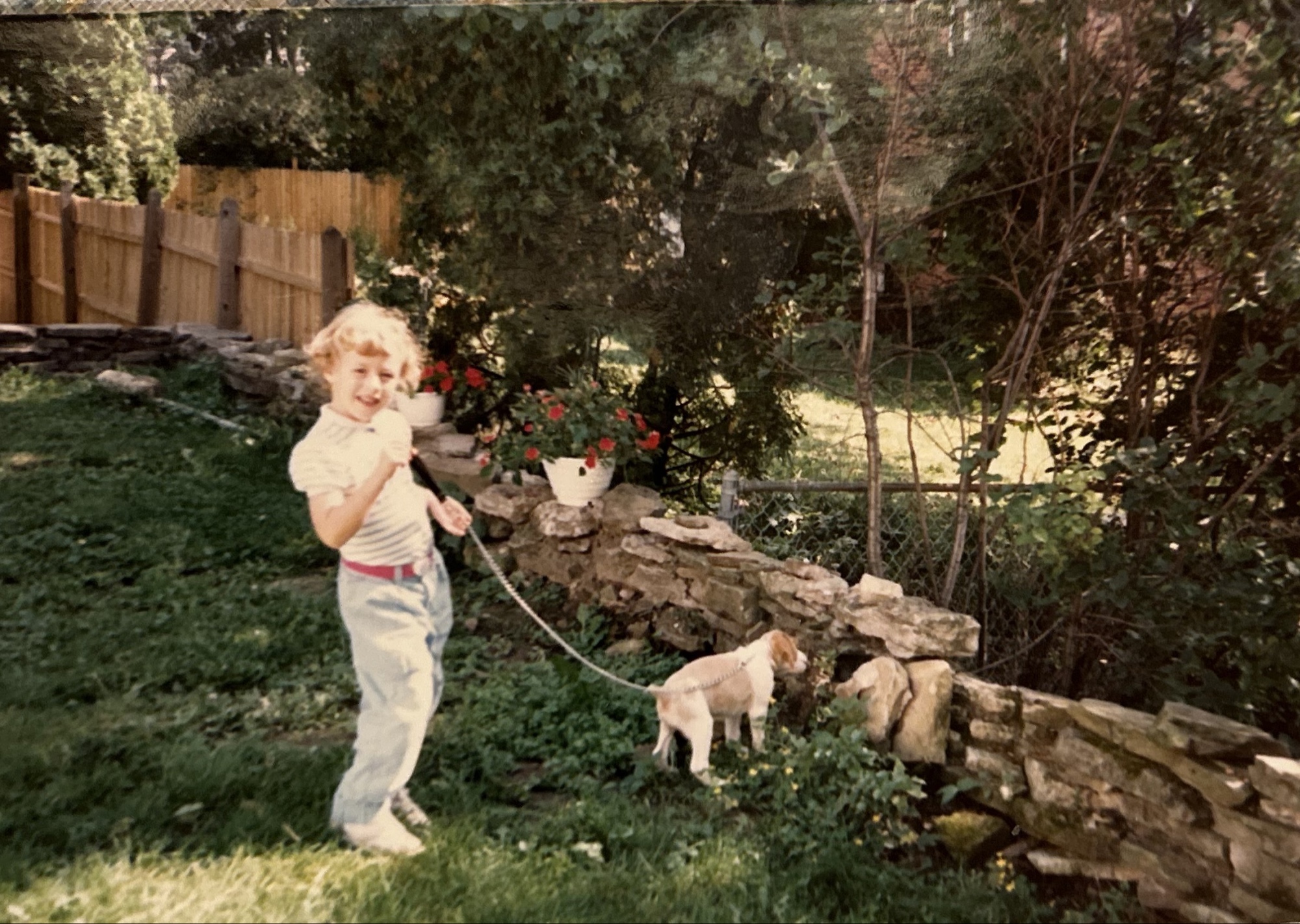 Ruth at 4 years old in 1988 holding her first spaniel puppy